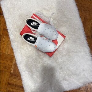 Nike White Slip-On Sneakers with Black Mini Swooshes